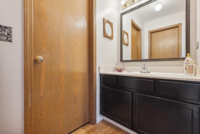 307 Valley Rd, North Aurora, IL 60542 - bathroom with vanity and wood finished floors