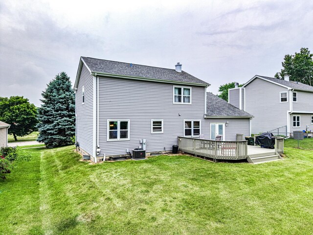 307 Valley Rd, North Aurora, IL 60542 - back of property with a yard, a wooden deck, a chimney, and roof with shingles