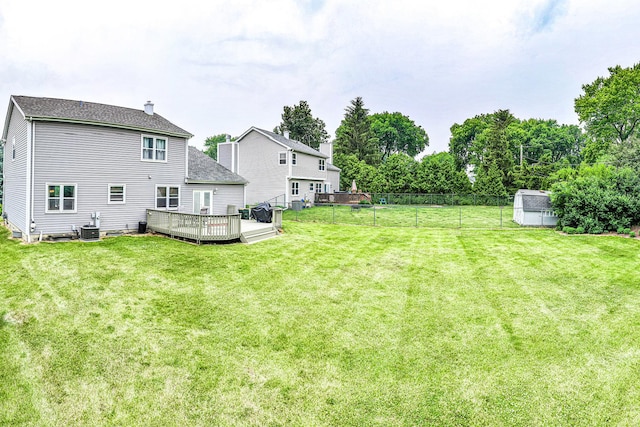 307 Valley Rd, North Aurora, IL 60542 - view of yard featuring a wooden deck and a shed