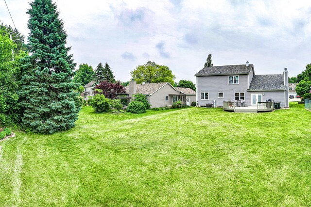 307 Valley Rd, North Aurora, IL 60542 - view of grassy yard with a deck