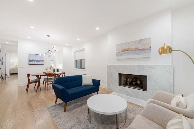 832 W Altgeld St Unit 1, Chicago, IL 60614 - living area with light wood finished floors, recessed lighting, a fireplace, and a chandelier