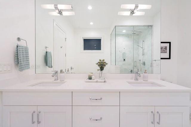 832 W Altgeld St Unit 1, Chicago, IL 60614 - bathroom with a marble finish shower, double vanity, and recessed lighting