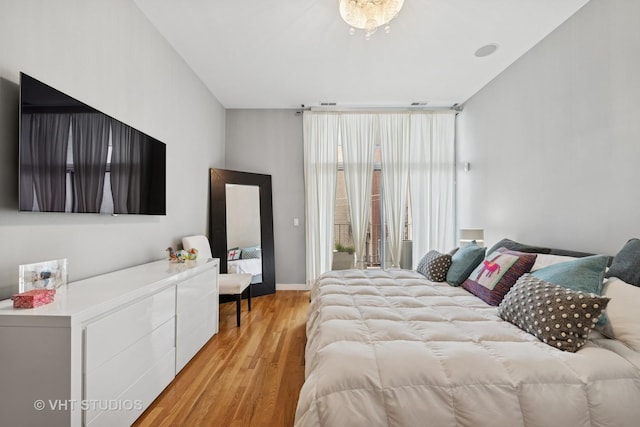 1711 W Division St Unit 303, Chicago, IL 60622 - bedroom with light wood-type flooring and access to outside
