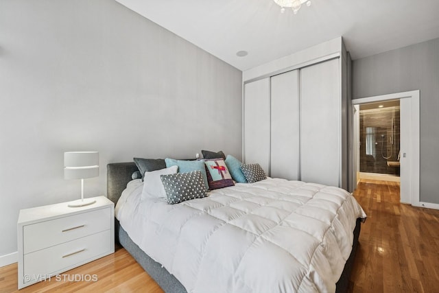 1711 W Division St Unit 303, Chicago, IL 60622 - bedroom with wood finished floors and a closet