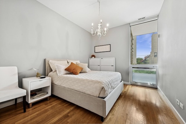 1711 W Division St Unit 303, Chicago, IL 60622 - bedroom with wood finished floors and a chandelier