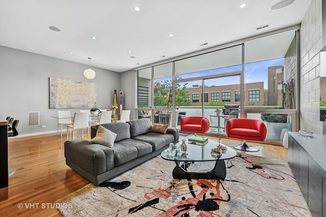 1711 W Division St Unit 303, Chicago, IL 60622 - living area with wood finished floors, recessed lighting, and a wall of windows