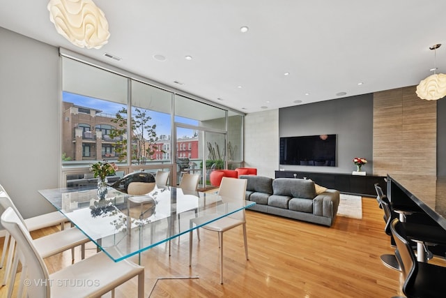 1711 W Division St Unit 303, Chicago, IL 60622 - dining area featuring wood finished floors, recessed lighting, and a wall of windows