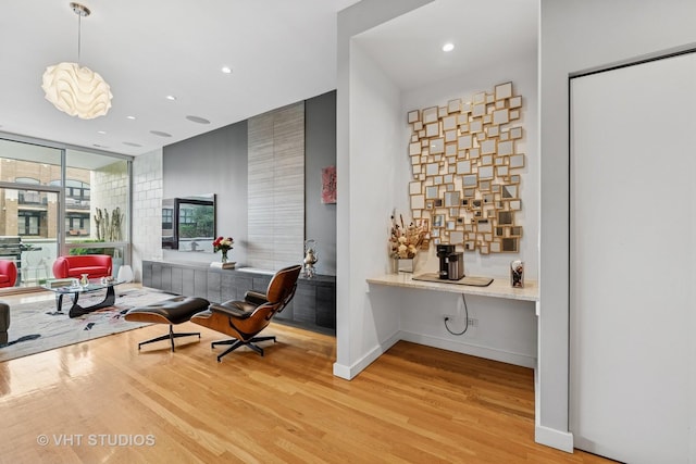 1711 W Division St Unit 303, Chicago, IL 60622 - bar featuring light wood-style floors, recessed lighting, and decorative light fixtures
