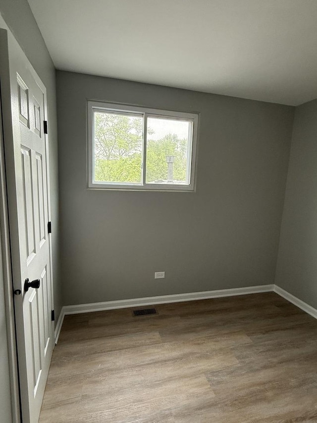 907 Gael Dr Unit D, Joliet, IL 60435 - unfurnished bedroom with baseboards and light wood-style flooring