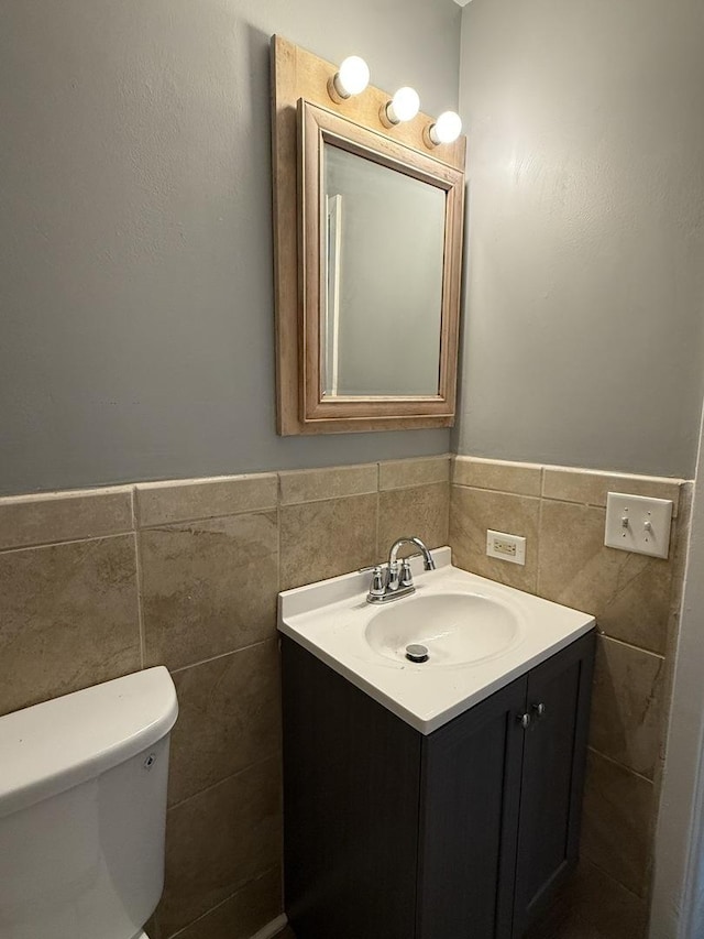 907 Gael Dr Unit D, Joliet, IL 60435 - half bathroom with tile walls, vanity, and wainscoting