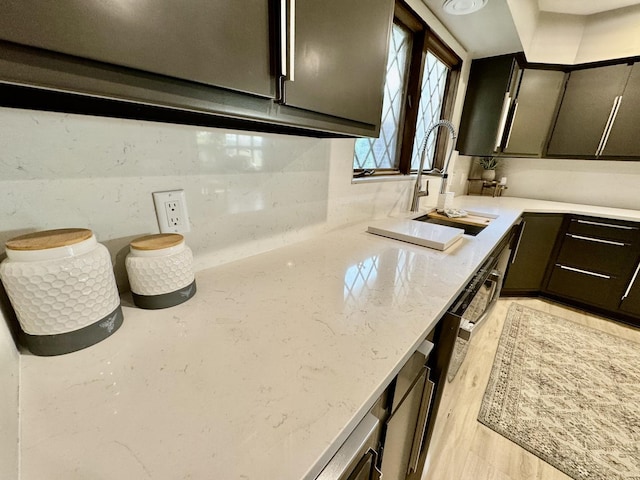 221 Thornbrook Rd, Dekalb, IL 60115 - kitchen with light stone counters and light wood-style flooring