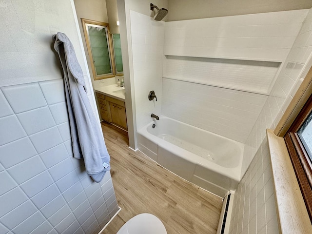 221 Thornbrook Rd, Dekalb, IL 60115 - full bathroom with wood finished floors, washtub / shower combination, vanity, and a baseboard heating unit