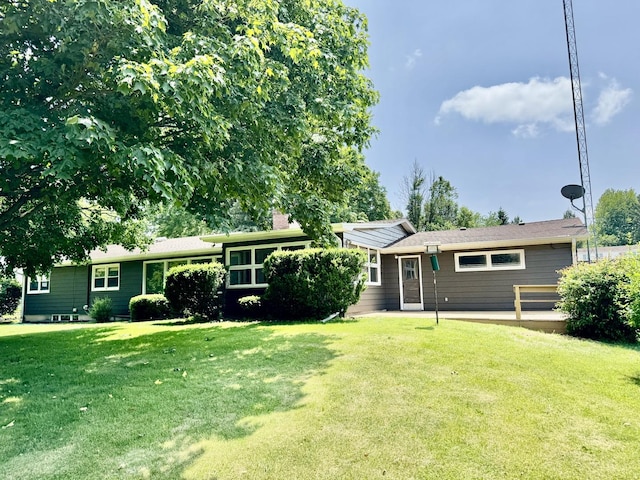 221 Thornbrook Rd, Dekalb, IL 60115 - view of front of house featuring a front lawn, a chimney, and a patio area