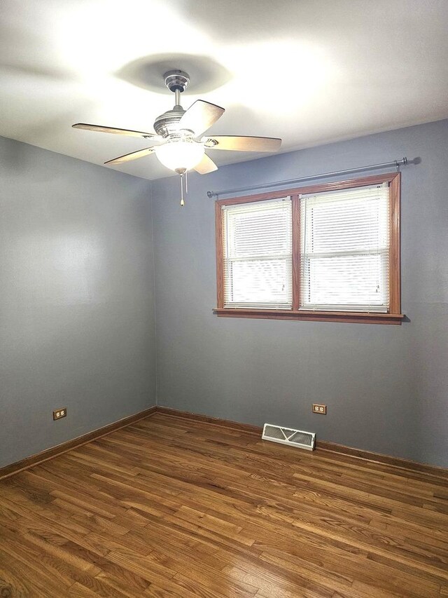 6512 Ridge Dr, Chicago Ridge, IL 60415 - empty room featuring wood finished floors and a ceiling fan