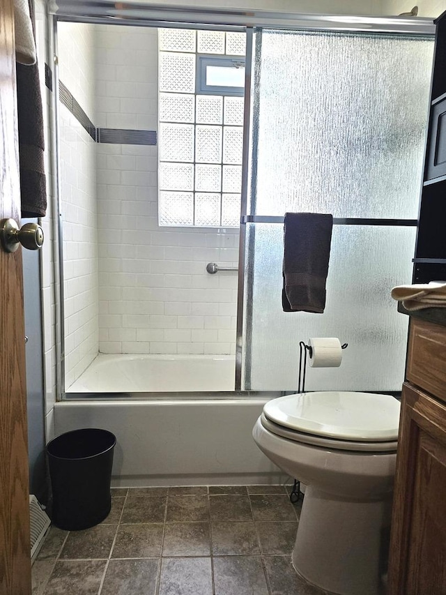 6512 Ridge Dr, Chicago Ridge, IL 60415 - full bathroom featuring combined bath / shower with glass door, stone tile flooring, and vanity