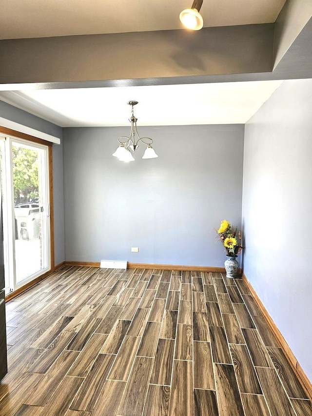 6512 Ridge Dr, Chicago Ridge, IL 60415 - unfurnished dining area with dark wood-style flooring and a chandelier