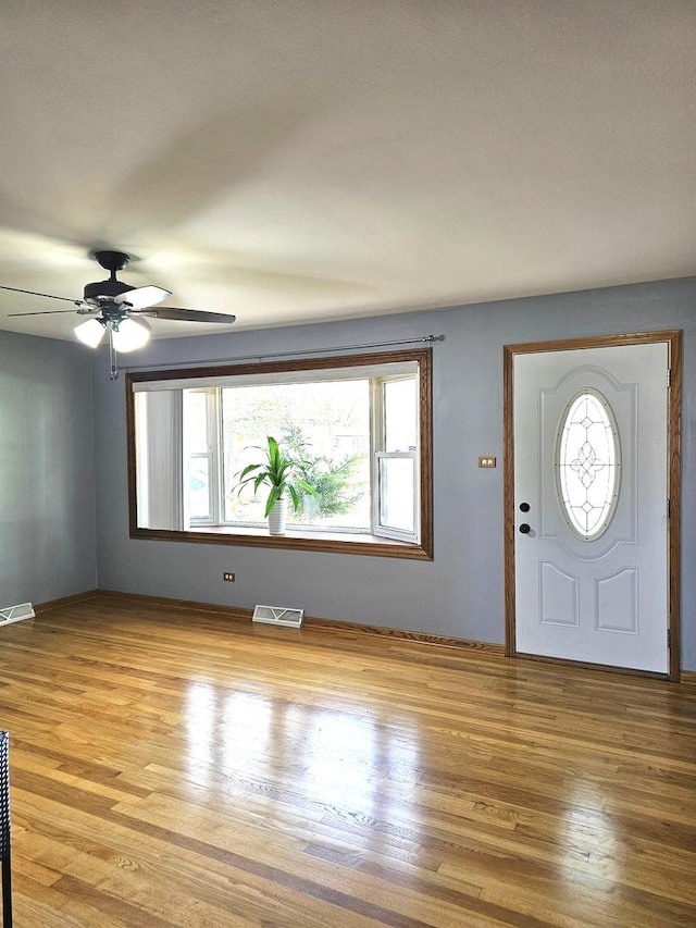 6512 Ridge Dr, Chicago Ridge, IL 60415 - entrance foyer with light wood-style floors and ceiling fan