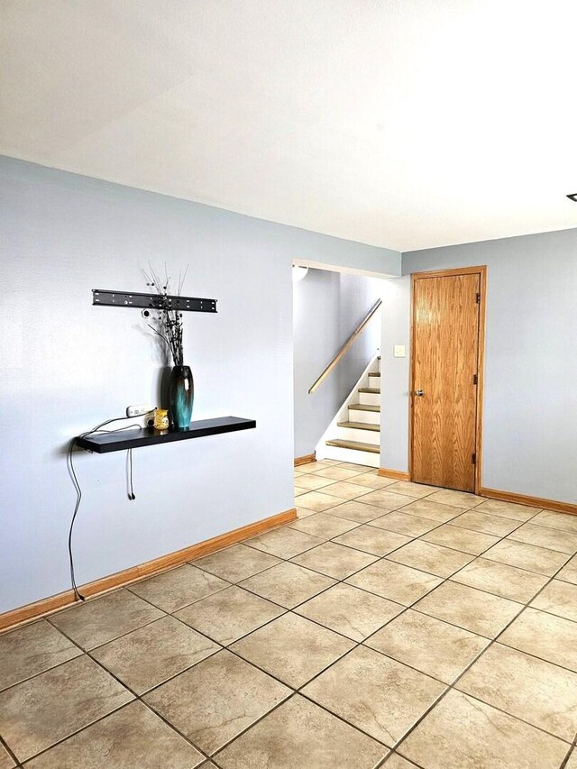 6512 Ridge Dr, Chicago Ridge, IL 60415 - spare room with stairs and light tile patterned flooring