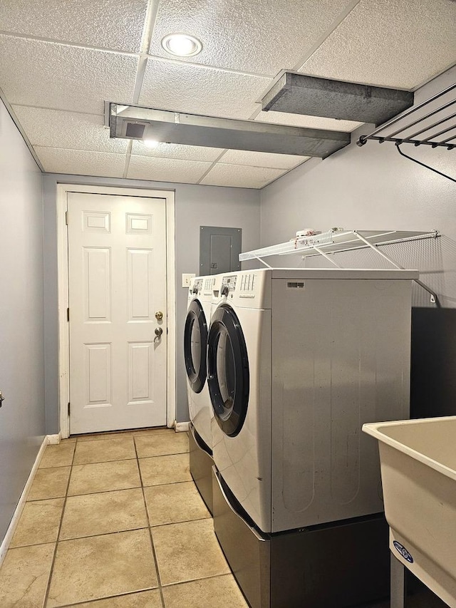 6512 Ridge Dr, Chicago Ridge, IL 60415 - laundry area featuring electric panel, washer and dryer, and light tile patterned floors