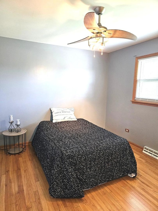 6512 Ridge Dr, Chicago Ridge, IL 60415 - bedroom with wood finished floors and a ceiling fan