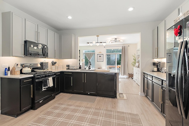 1526 Peachtree Ln, Lockport, IL 60441 - kitchen with black appliances, light wood-style flooring, light countertops, and recessed lighting