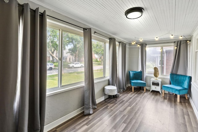956 S Elm Ave, Kankakee, IL 60901 - sunroom / solarium with plenty of natural light, wood finished floors, ornamental molding, and wooden ceiling