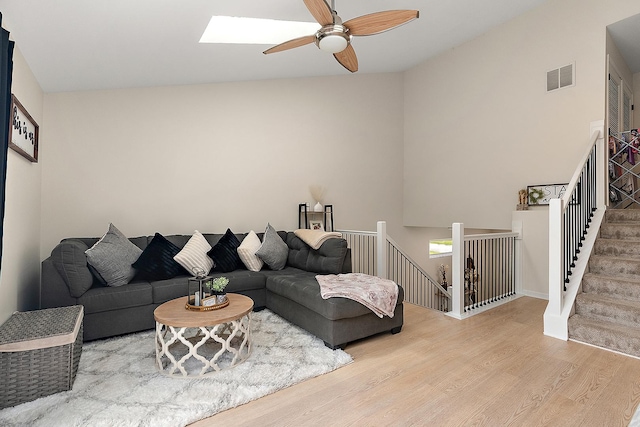 1602 Peachtree Ln, Lockport, IL 60441 - living area featuring wood finished floors, ceiling fan, a skylight, and high vaulted ceiling