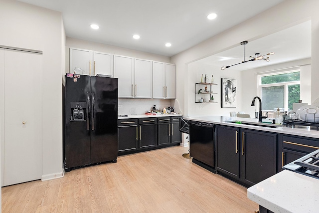 1528 Peachtree Ln, Lockport, IL 60441 - kitchen with black appliances, light wood-type flooring, dark cabinetry, recessed lighting, and decorative backsplash