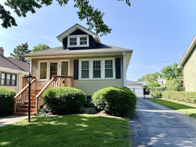 98 Northgate Rd, Riverside, IL 60546 - bungalow-style home with a front yard and an outbuilding