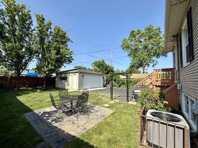 98 Northgate Rd, Riverside, IL 60546 - view of yard featuring an outbuilding, a garage, and a patio
