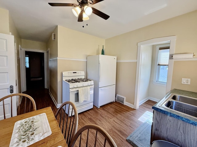 98 Northgate Rd, Riverside, IL 60546 - kitchen with white appliances, ceiling fan, and wood finished floors