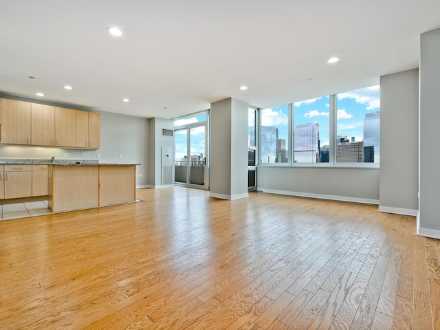 737 W Washington Blvd Unit 3003, Chicago, IL 60661 - unfurnished living room featuring light wood-style floors, recessed lighting, and a city view