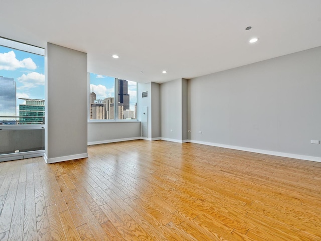 737 W Washington Blvd Unit 3003, Chicago, IL 60661 - unfurnished living room with light wood-style floors, a view of city, and recessed lighting
