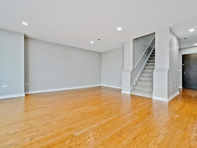 737 W Washington Blvd Unit 3003, Chicago, IL 60661 - unfurnished living room featuring light wood-style floors, stairway, and recessed lighting