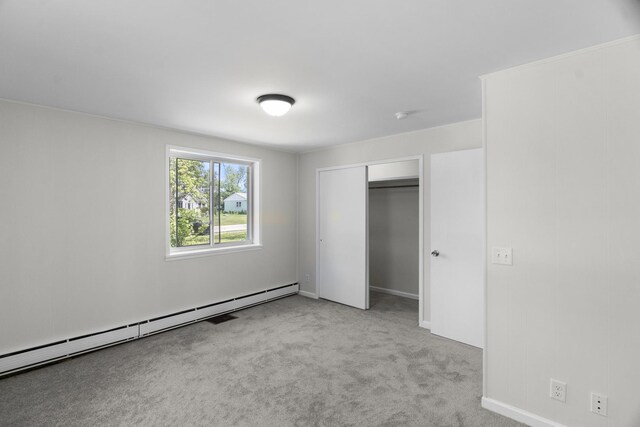 930 S Chatham Ave, Addison, IL 60101 - unfurnished bedroom featuring a baseboard radiator, carpet, and a closet