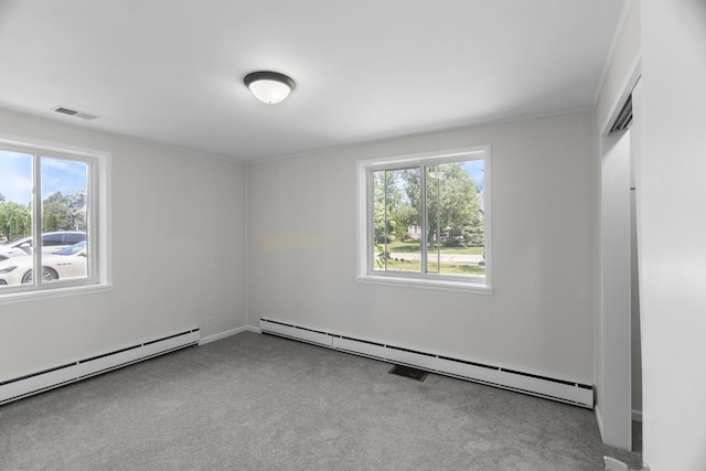 930 S Chatham Ave, Addison, IL 60101 - unfurnished bedroom featuring baseboard heating, multiple windows, a baseboard heating unit, and carpet
