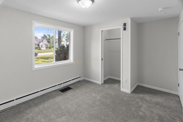930 S Chatham Ave, Addison, IL 60101 - unfurnished bedroom featuring a baseboard radiator, carpet floors, and a closet