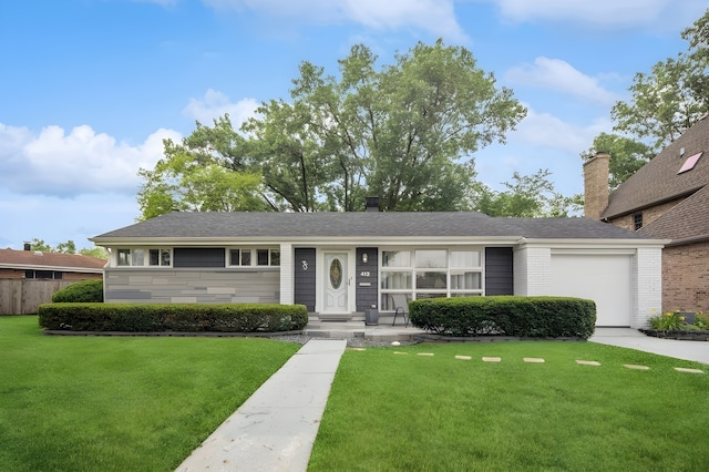 412 N Ridgeland Ave, Elmhurst, IL 60126 - single story home with a front lawn, an attached garage, a chimney, and brick siding