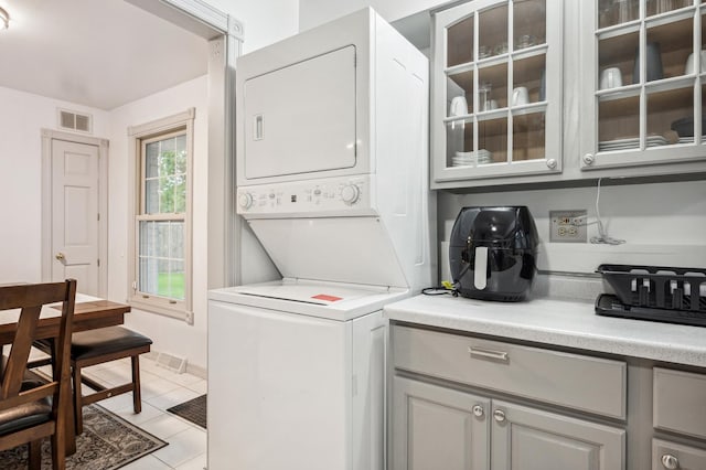 412 N Ridgeland Ave, Elmhurst, IL 60126 - laundry room with stacked washer and clothes dryer and light tile patterned floors