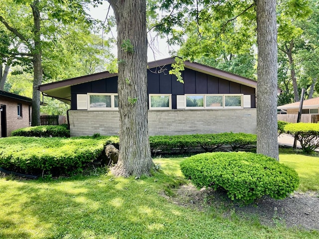 336 Flossmoor Ave, Waukegan, IL 60085 - view of property exterior with board and batten siding and brick siding