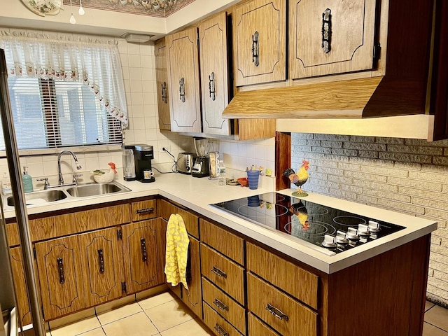 336 Flossmoor Ave, Waukegan, IL 60085 - kitchen with black electric stovetop, light tile patterned floors, light countertops, and backsplash