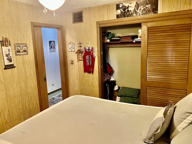 336 Flossmoor Ave, Waukegan, IL 60085 - bedroom featuring a closet and wood walls