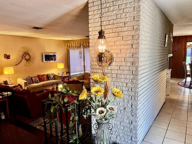 336 Flossmoor Ave, Waukegan, IL 60085 - tiled living room with a textured ceiling and wood walls