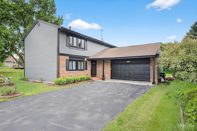 111 Mayberry Ct, Rolling Meadows, IL 60008 - view of front facade featuring brick siding, a garage, a front yard, and asphalt driveway