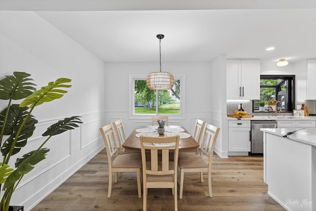 111 Mayberry Ct, Rolling Meadows, IL 60008 - dining area featuring wainscoting, light wood finished floors, a decorative wall, and recessed lighting