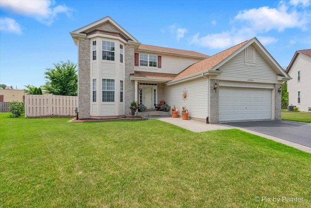 28909 Honeysuckle Ct, Lakemoor, IL 60051 - view of front of house with driveway, a garage, and roof with shingles