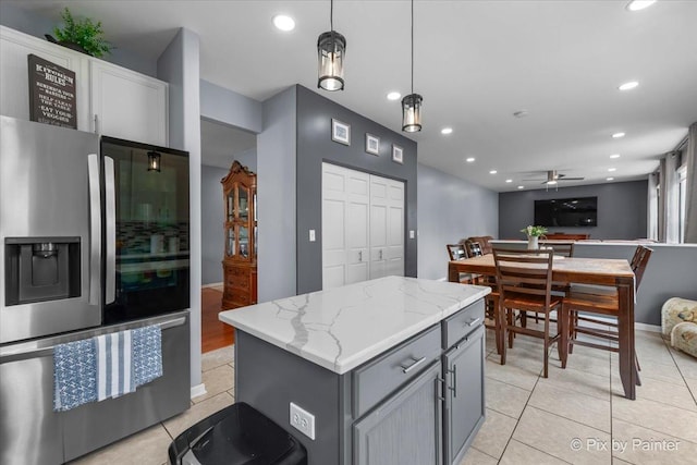 28909 Honeysuckle Ct, Lakemoor, IL 60051 - kitchen with stainless steel refrigerator with ice dispenser, light tile patterned flooring, ceiling fan, gray cabinets, and open floor plan