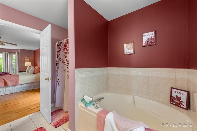28909 Honeysuckle Ct, Lakemoor, IL 60051 - ensuite bathroom featuring a garden tub, tile patterned floors, ceiling fan, and a shower with curtain