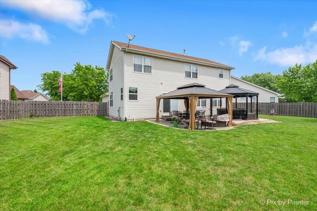 28909 Honeysuckle Ct, Lakemoor, IL 60051 - back of property with a gazebo, a patio, and a fenced backyard