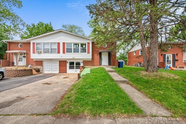 6710 Valley View Rd, Hanover Park, IL 60133 - view of front of property with driveway, a garage, brick siding, and a front yard